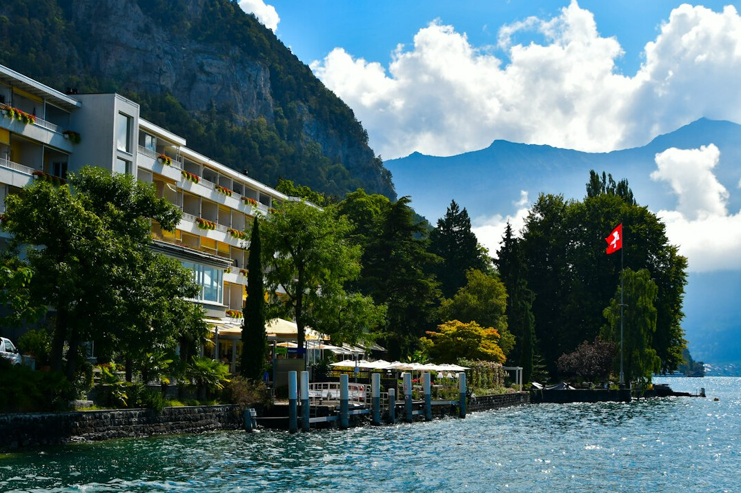 Luxury hotel facade with lake and mountain view in Switzerland