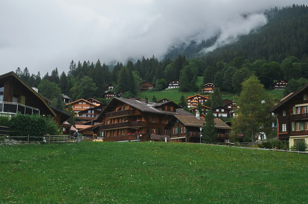 Picturesque Swiss village with wooden houses and mountains